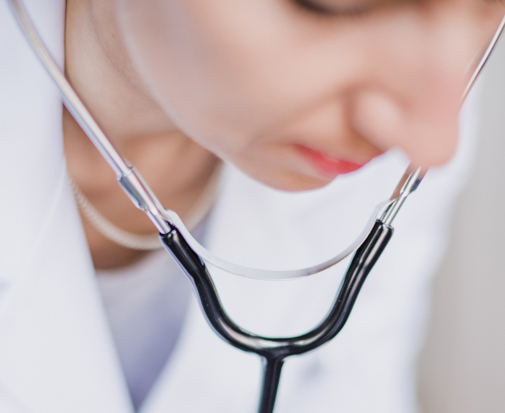 Doctor using ultrasound equipment